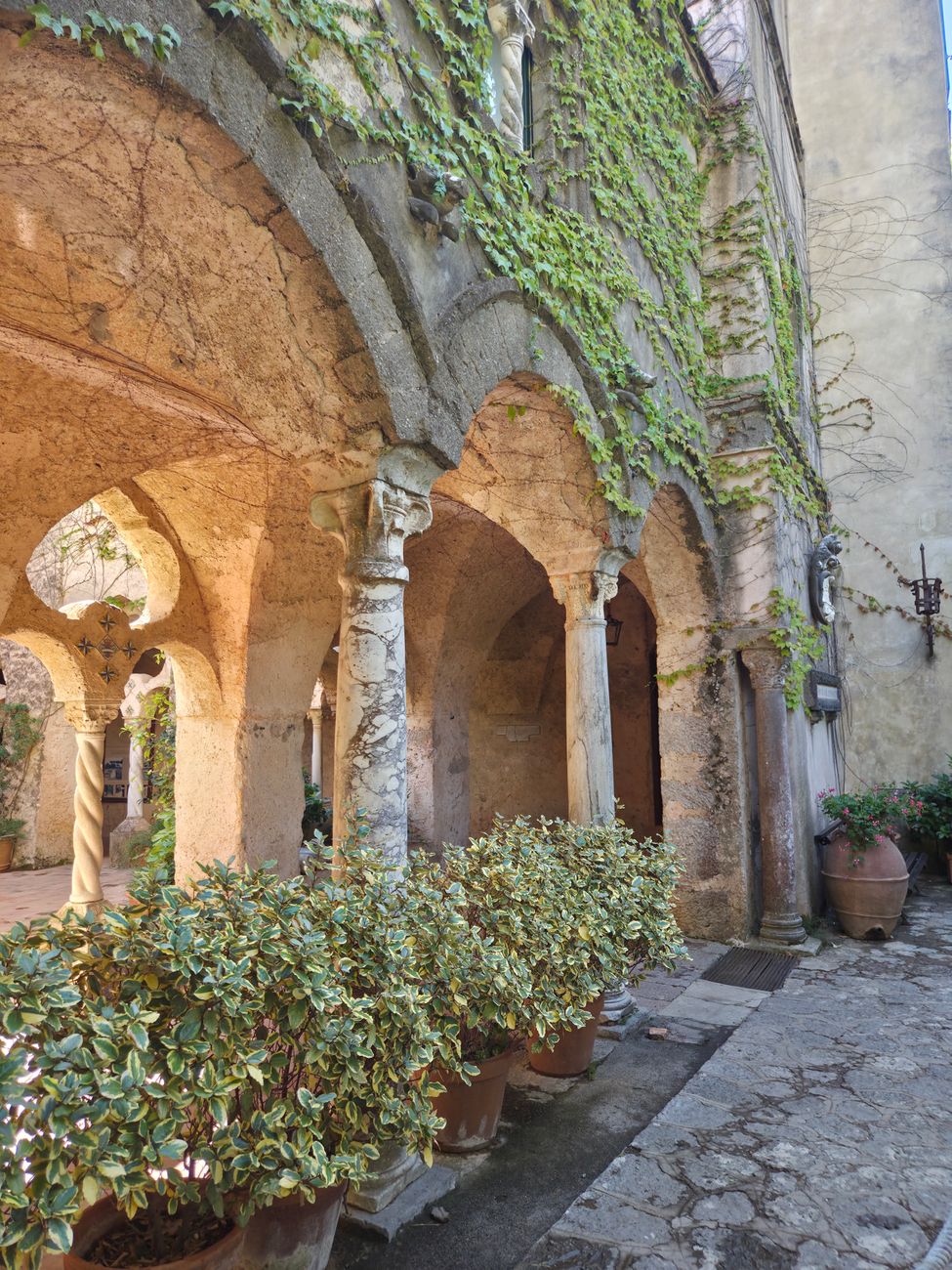 Sunlit Mediterranean stone cloister by the ocean